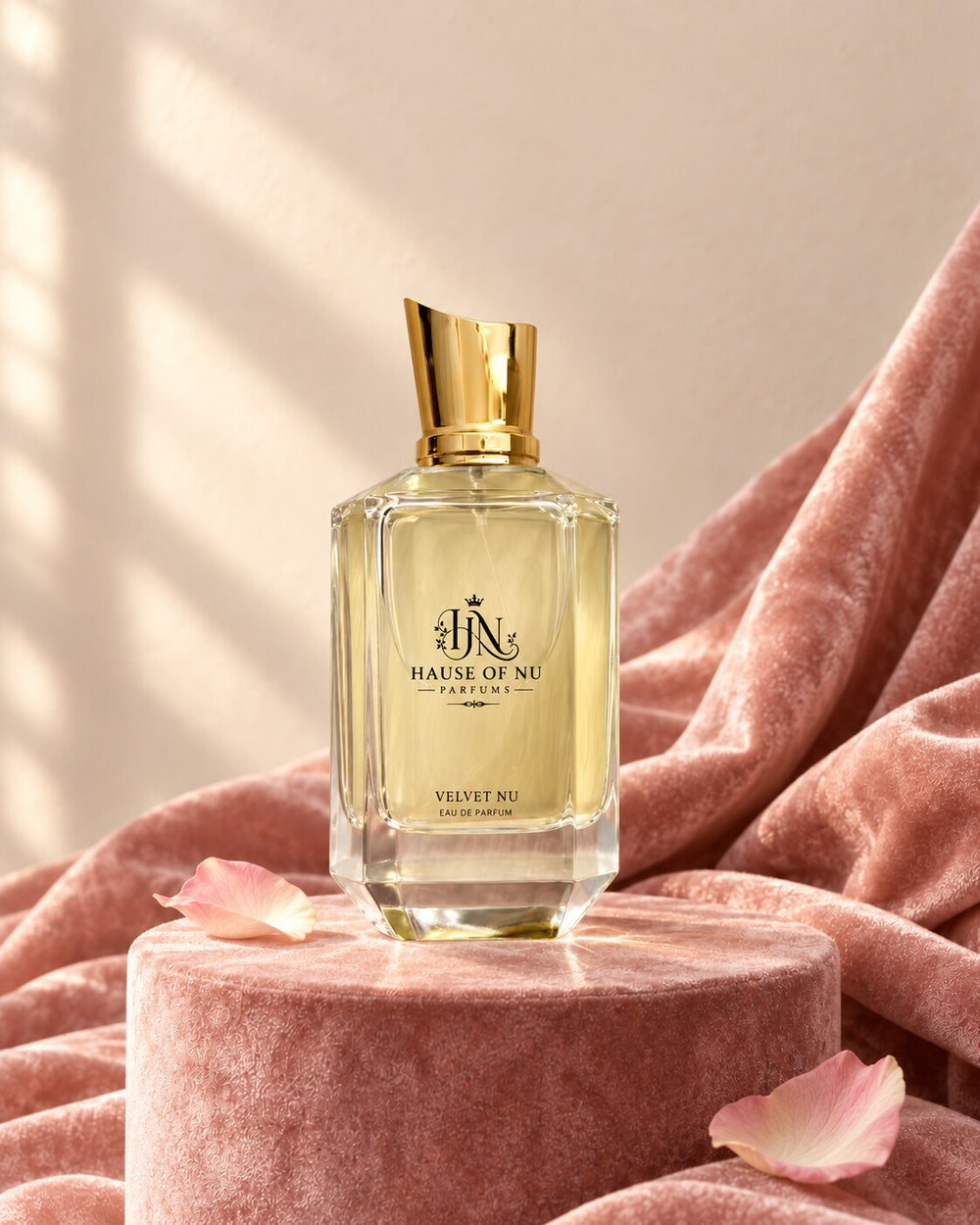 Velvet Nu Eau de Parfum on a blush velvet plinth